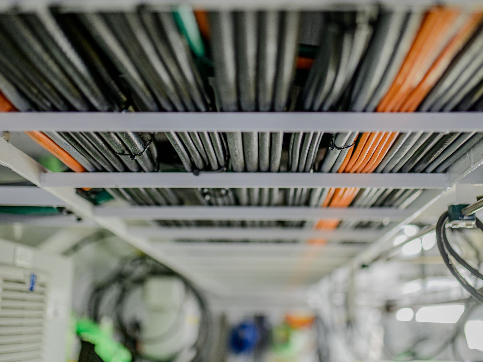 Marine cabling being routed along primary cable trays by Black Frog Elektro technicians.