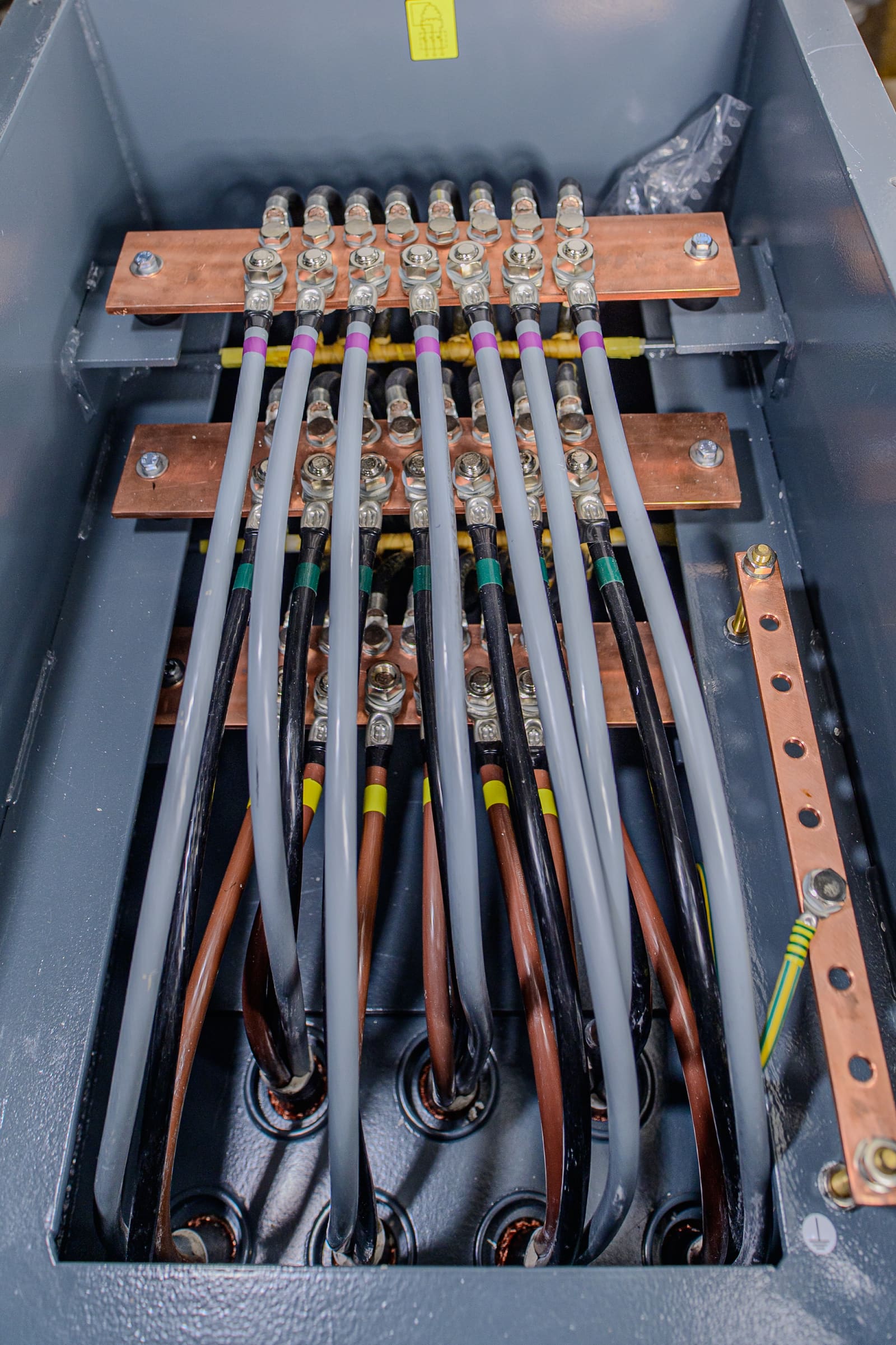 Main switchboard incomer cable termination with parallel single-core cables landed on copper busbars through tinned compression lugs