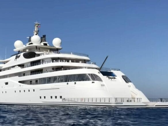 147-metre motor superyacht at sea during refit period in Abu Dhabi, white multi-deck superstructure with radar domes.