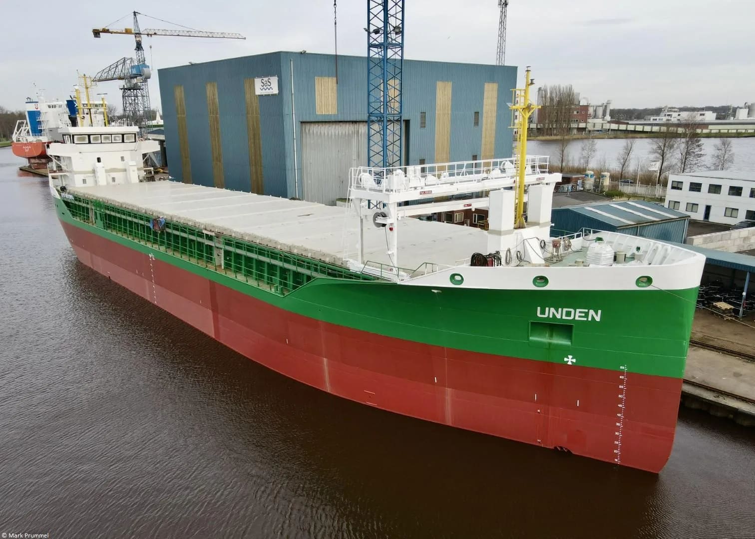 General cargo vessel Unden for Braren moored at Ship & Steelbuilding Foxhol yard, red and green hull with white superstructure.